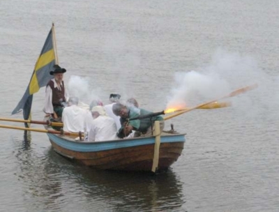 A shot is fired from the boat's bow-mounted gun